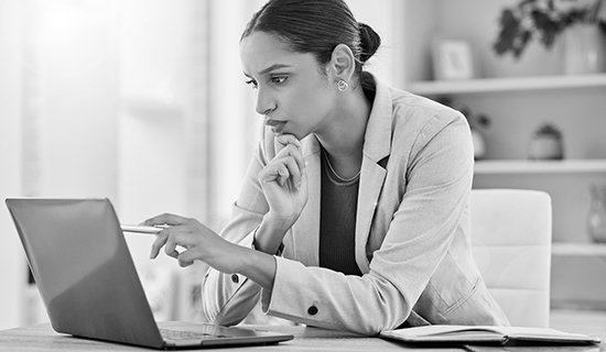 Woman pointing to laptop screen