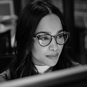 Closeup of woman working at a computer.