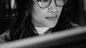 Closeup of woman working at a computer.